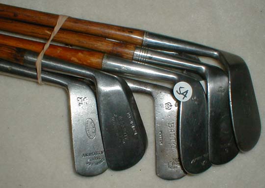 Gifts for the Golfer! Golf Gifts. Wooden Shaft Golf Clubs and Collectibles, Antique Golf Balls and golf collectables.  Hickory Golf Clubs - Great artifacts for interior decorating! Rare coins on ebay.  Gofl clubs.